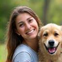 Smiling customer holding her dog